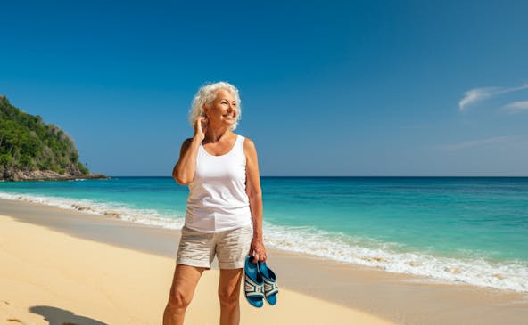 Retired woman at beach